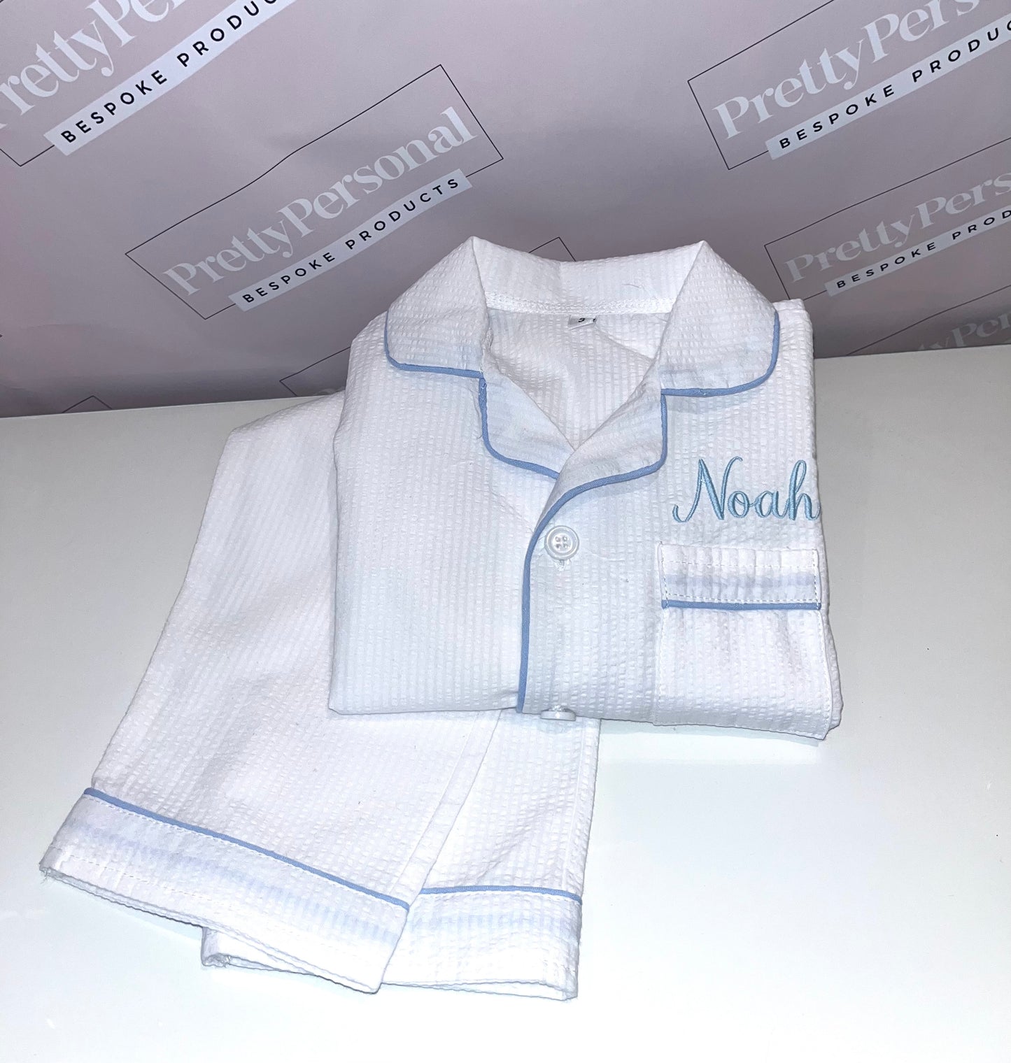 Boys White Seersucker PJs with Pale Blue Lining Detail