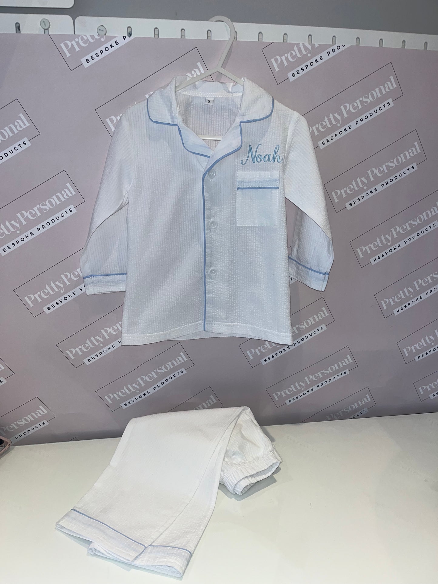 Boys White Suckseeker PJs with Pale Blue Lining Detail