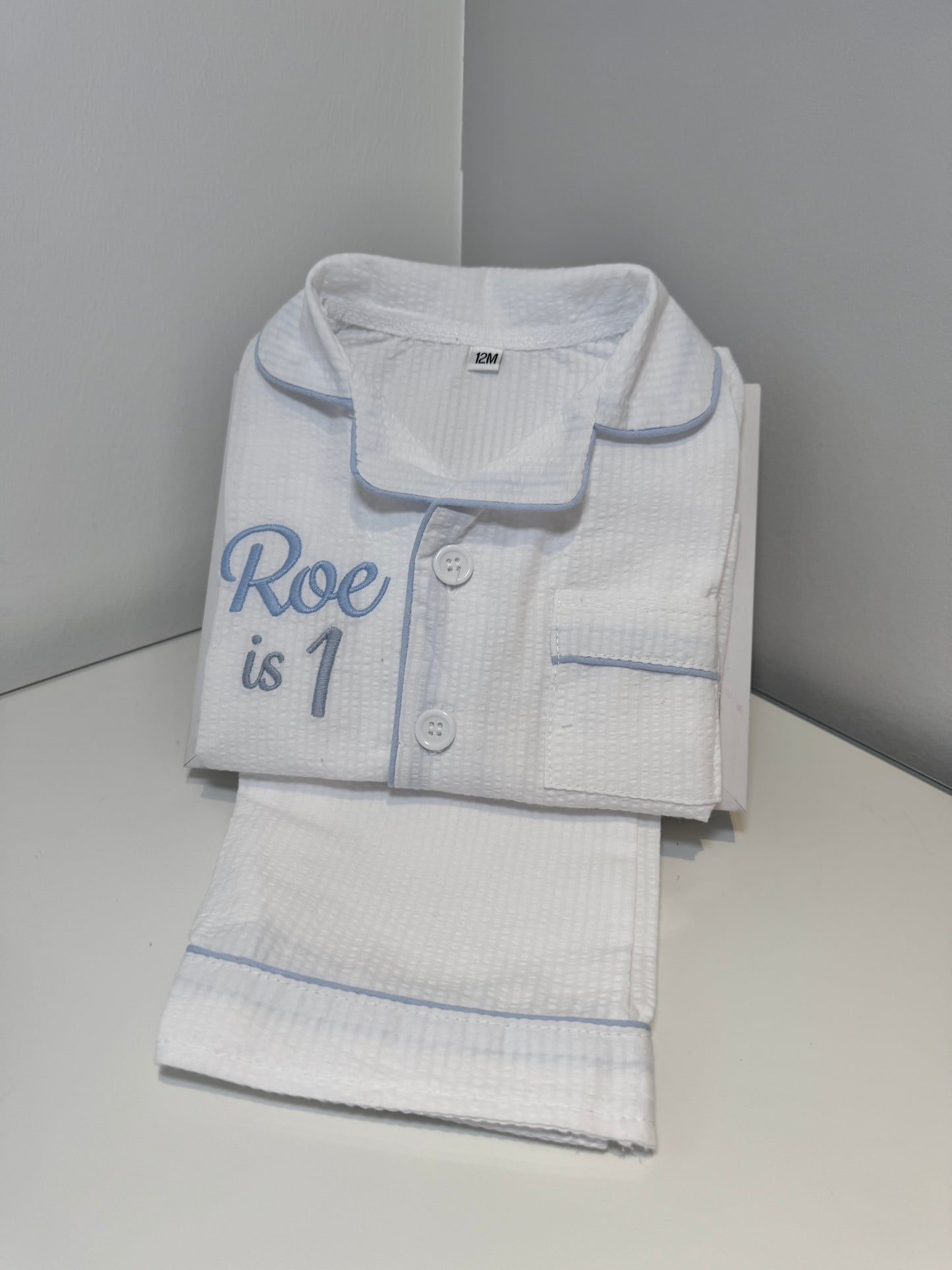 Boys White Suckseeker PJs with Pale Blue Lining Detail