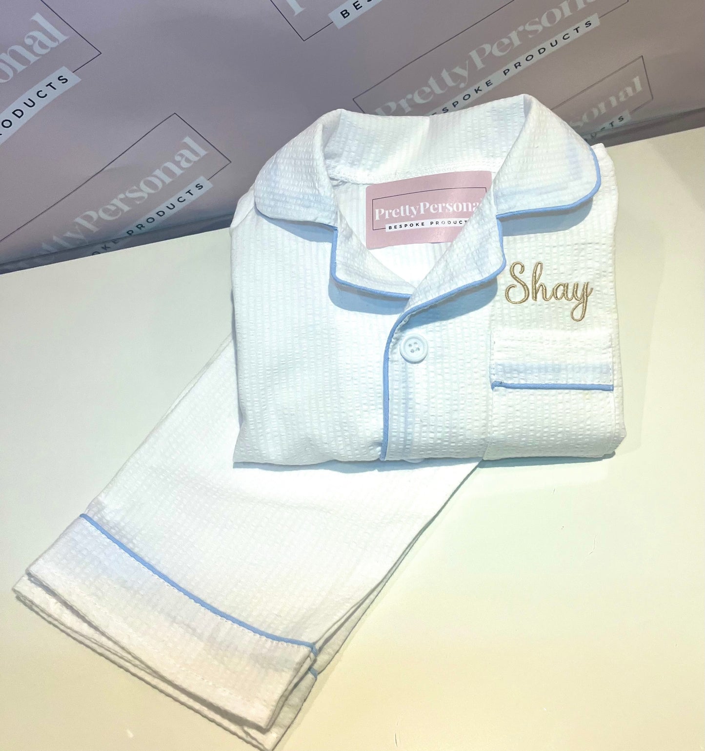 Boys White Suckseeker PJs with Pale Blue Lining Detail