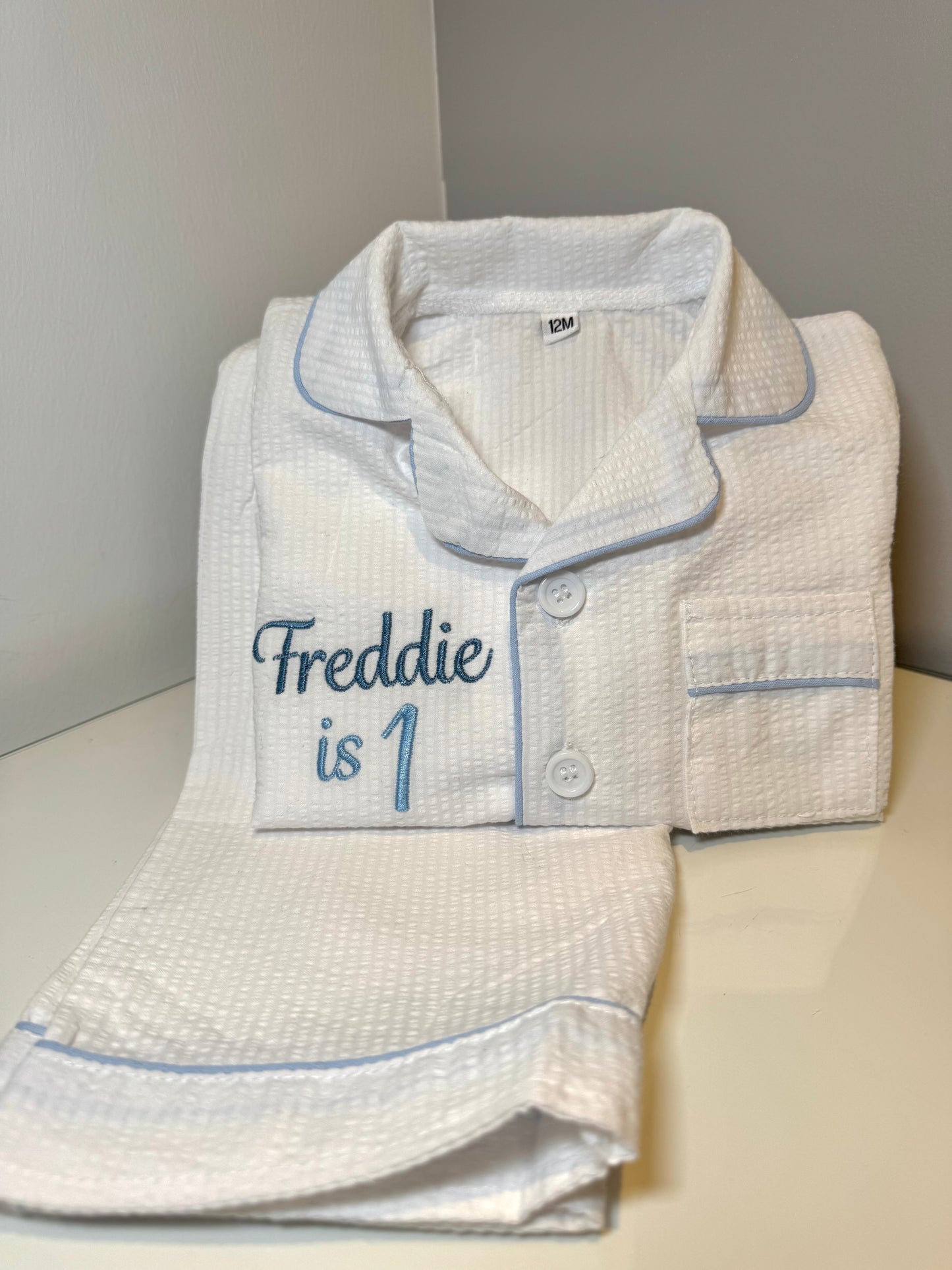 Boys White Suckseeker PJs with Pale Blue Lining Detail